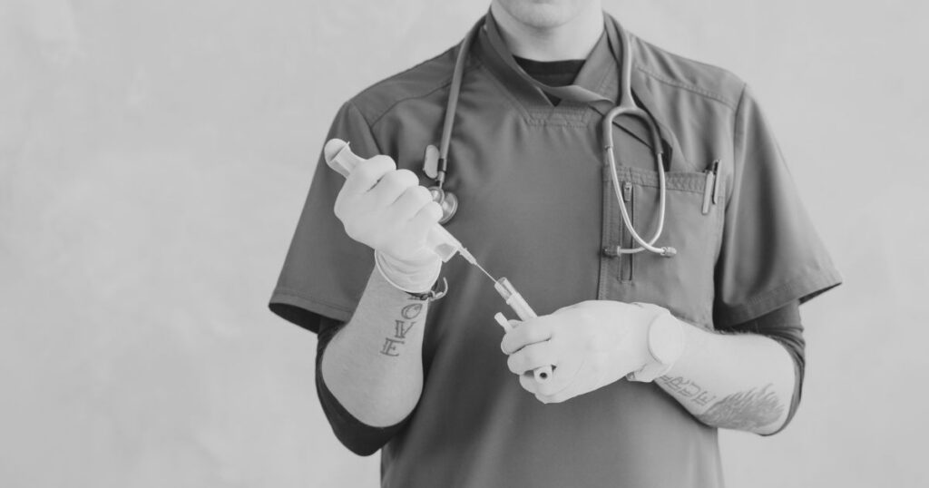 An injector holding a syringe.
